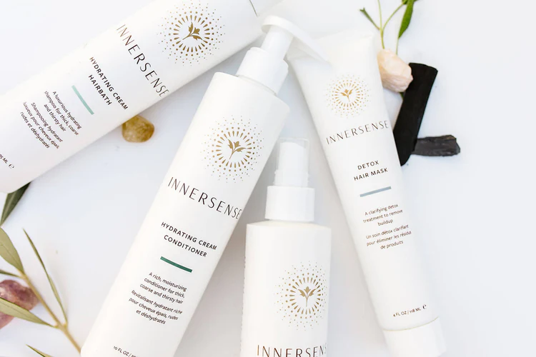 nnersense organic hair care products including Hydrating Cream Conditioner and Detox Hair Mask displayed with natural elements.
